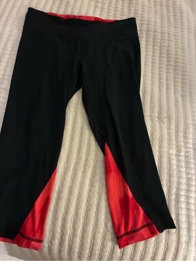 Under Armour Black Capri Leggings with Red Accent Panels